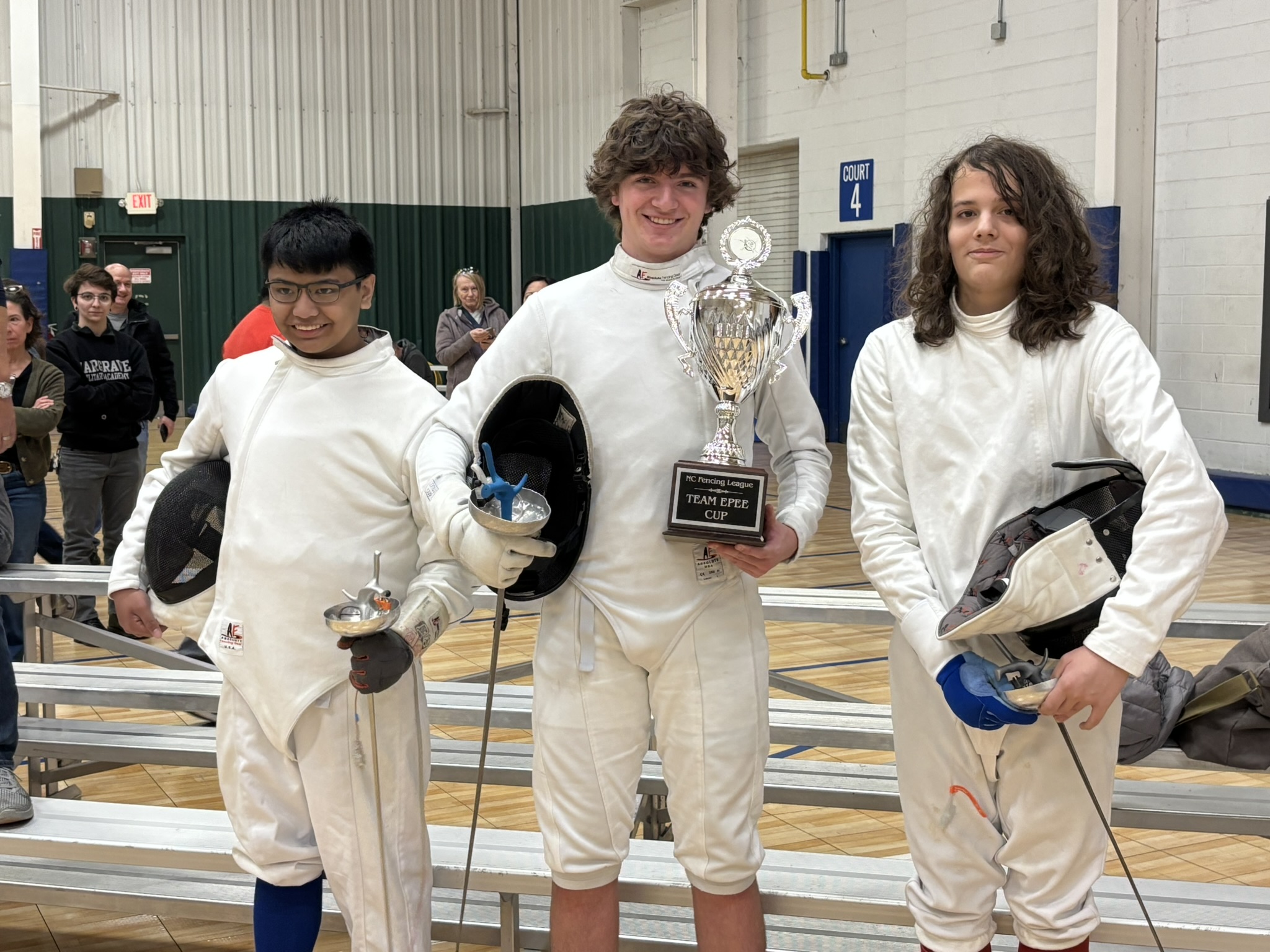 Fencing teammates together at a competition
