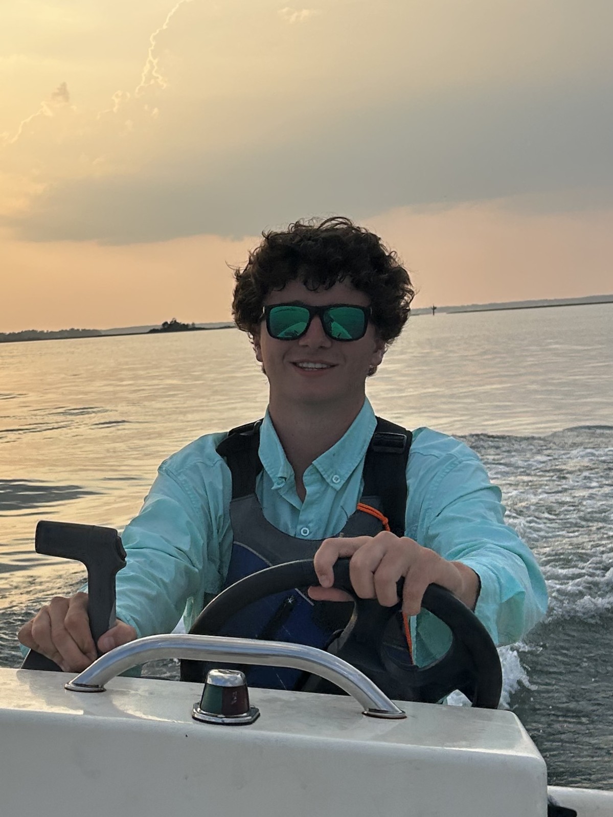 Joel by the water at sunset
